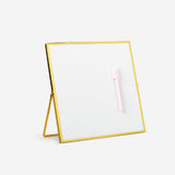 Gold magnetic office board with marker from Flying Tiger Copenhagen, featuring a sleek surface and magnetic functionality.