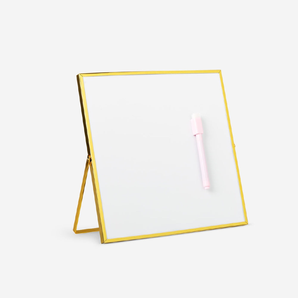 Gold magnetic office board with marker from Flying Tiger Copenhagen, featuring a sleek surface and magnetic functionality.
