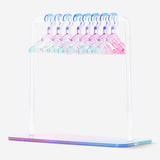 Gradient jewellery stand for earrings by Flying Tiger Copenhagen, modern home accessory with colorful tiered display.