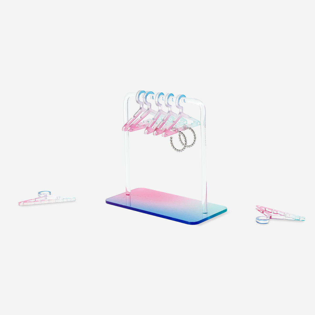 Gradient jewellery stand for earrings by Flying Tiger Copenhagen, stylish home accessory with colorful tiered design.