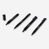Set of four black permanent markers from Flying Tiger Copenhagen, ideal for office writing and labeling tasks.