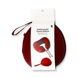 Flying Tiger Copenhagen memory foam travel pillow with storage case, showing the ergonomic shape and soft fabric cover.