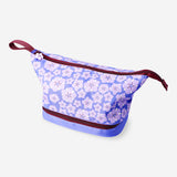 Purple floral Flying Tiger Copenhagen leisure toiletry bag with two compartments, featuring a vibrant floral pattern and zipper closures.