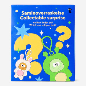 Colorful animal character keychain toy featuring surprise outfits, by Flying Tiger Copenhagen, with playful animal designs.