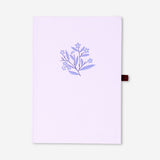 A5 lilac undated personal planner by Flying Tiger Copenhagen with a smooth cover and spiral binding for office organization.