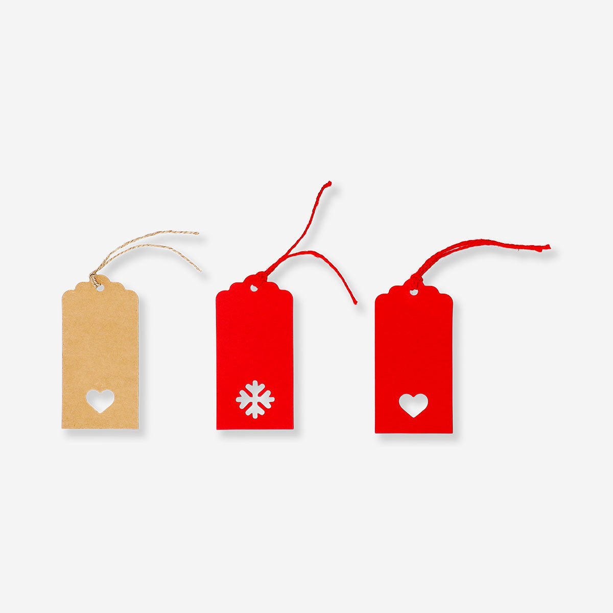 Set of four Manila gift tags with cut-out designs from Flying Tiger Copenhagen, ideal for office gift wrapping and labeling.