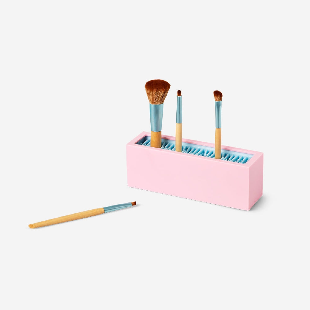 Pink cosmetic organiser for makeup brushes, Flying Tiger Copenhagen personal care item, measuring 18.5x6.5 cm, with compartments for brushes.