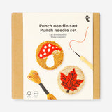 Two DIY punch needle coasters from Flying Tiger Copenhagen, colorful hobby craft with intricate stitched designs on fabric.