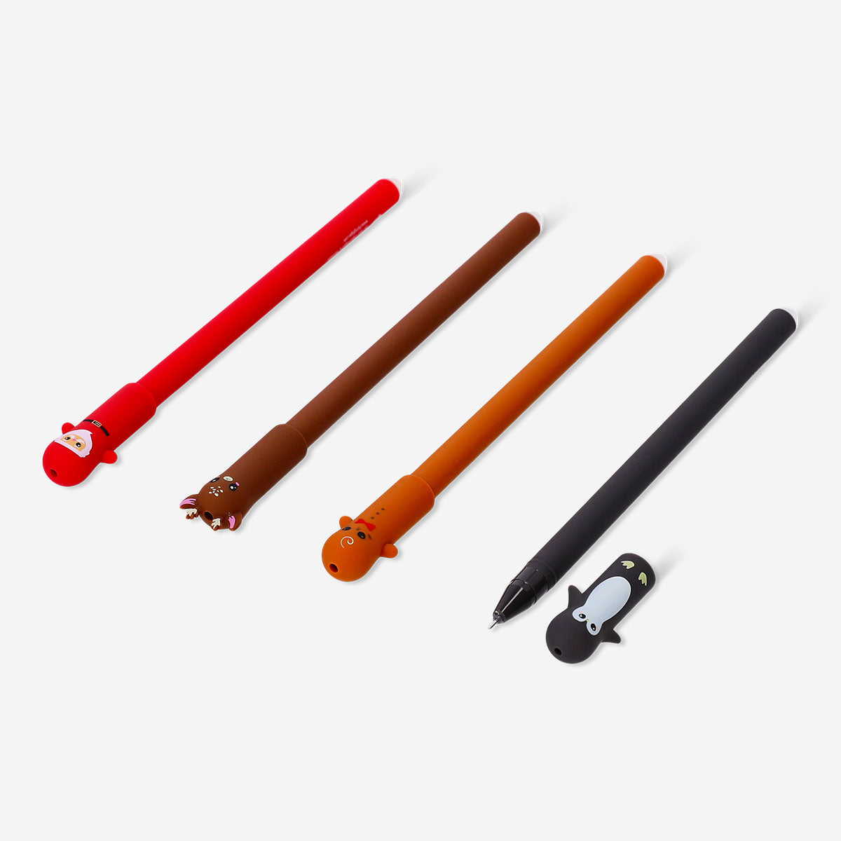 Set of four erasable office pens with festive Christmas toppers from Flying Tiger Copenhagen, ideal for holiday writing and gifting.