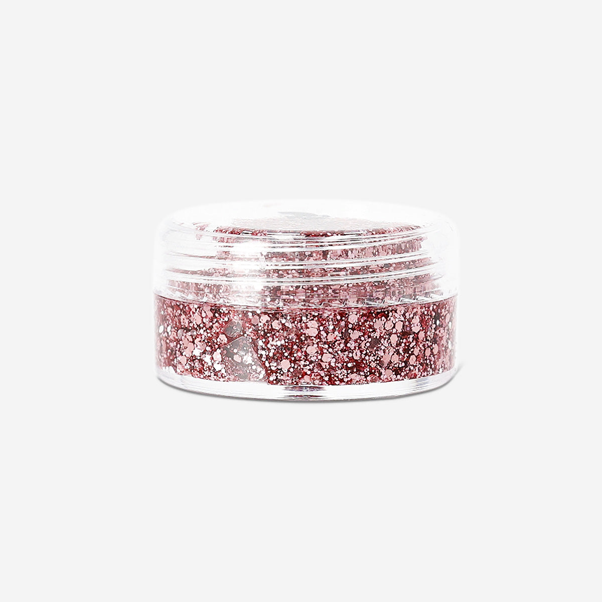 Pink glitter eyeshadow flakes from Flying Tiger Copenhagen, featuring shimmering, colorful aesthetic for eye makeup and personal care.