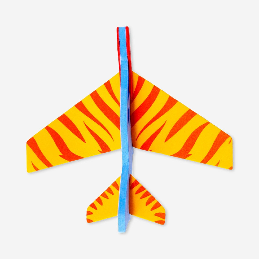 Mini glider plane toy from Flying Tiger Copenhagen, lightweight plastic aircraft ready for outdoor flying and fun.