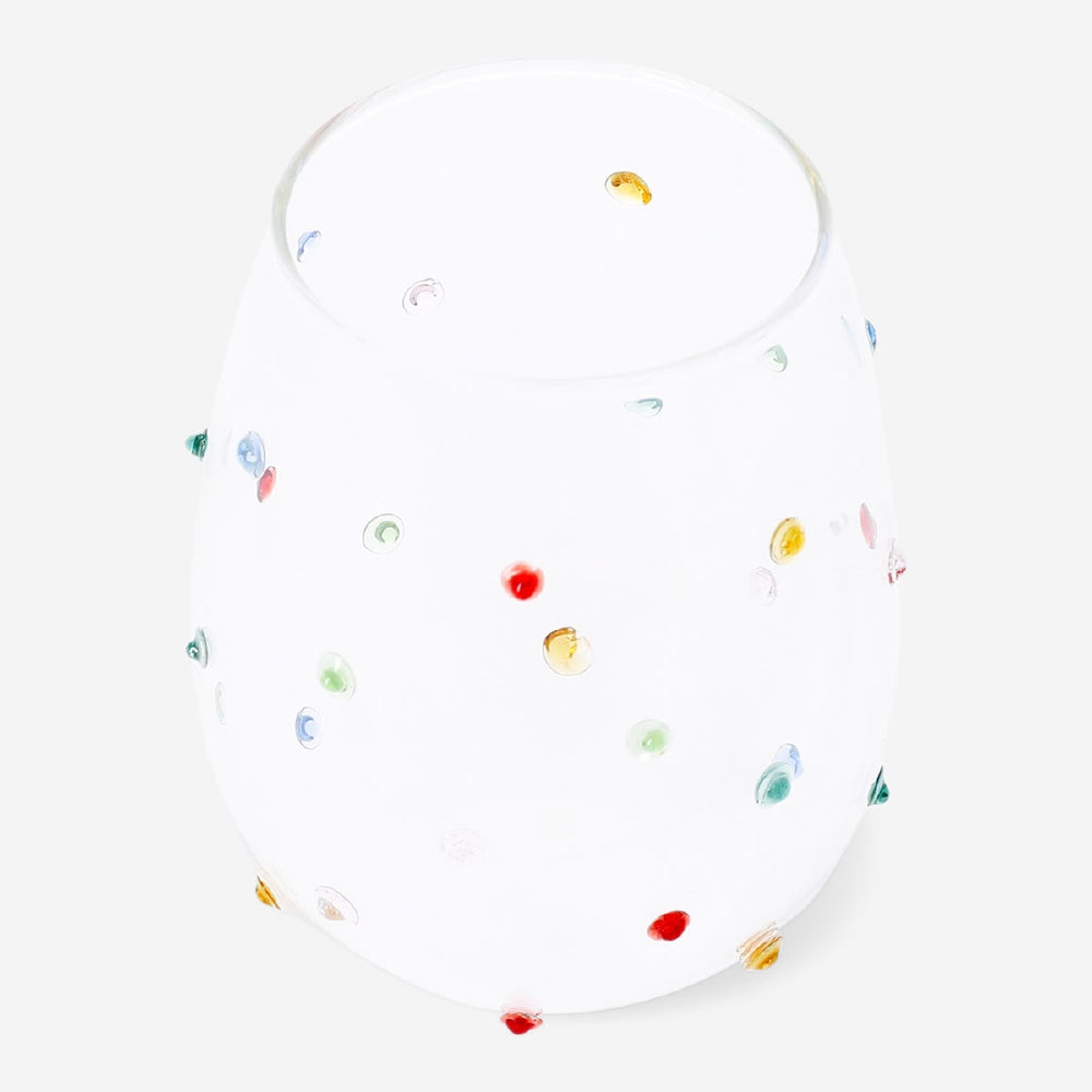 Colorful Flying Tiger Copenhagen kitchen drinking glass with multi-colored dot pattern on clear glass.