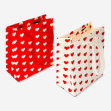 Set of four heart print gift bags for office use by Flying Tiger Copenhagen, featuring colorful heart designs.