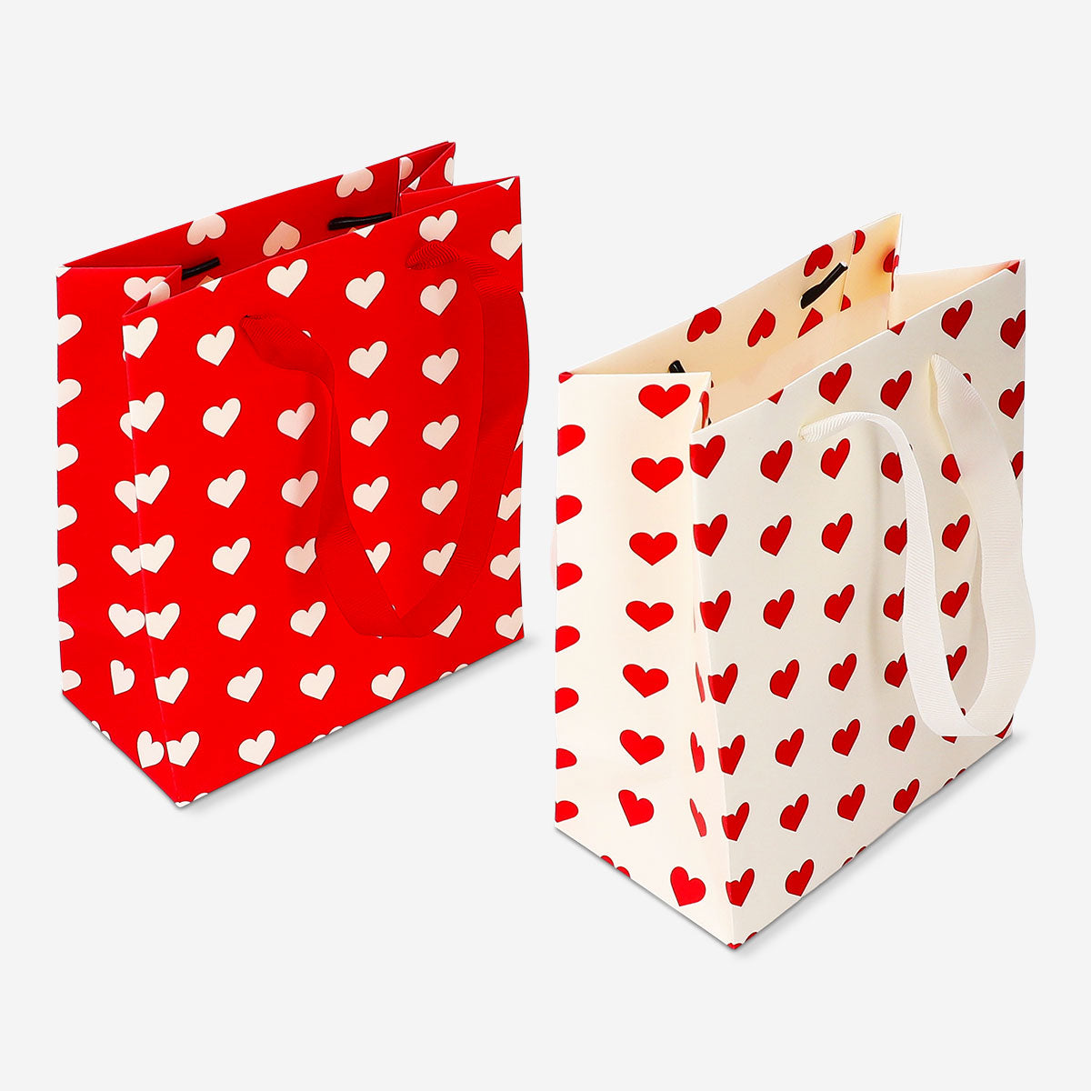 Set of four heart print gift bags for office use by Flying Tiger Copenhagen, featuring colorful heart designs.