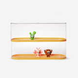 Stackable storage box for toy collections by Flying Tiger Copenhagen, 10 x 32 cm, with a clear lid and colorful interior.