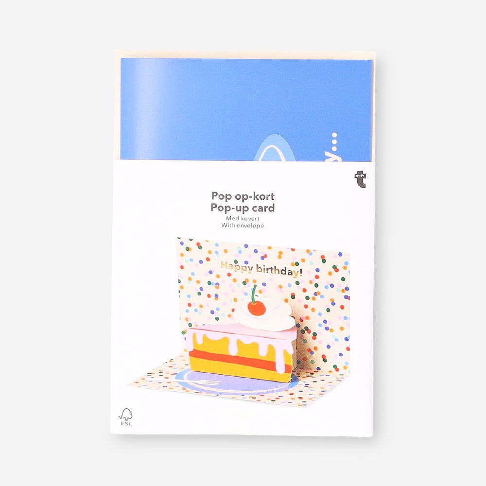 Flying Tiger Copenhagen birthday card featuring a colorful 3D pop-up cake slice design for office celebrations.