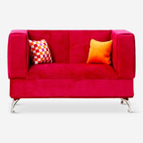 Pink velvet jewellery box shaped like a sofa from Flying Tiger Copenhagen, featuring detailed embroidery and plush fabric.