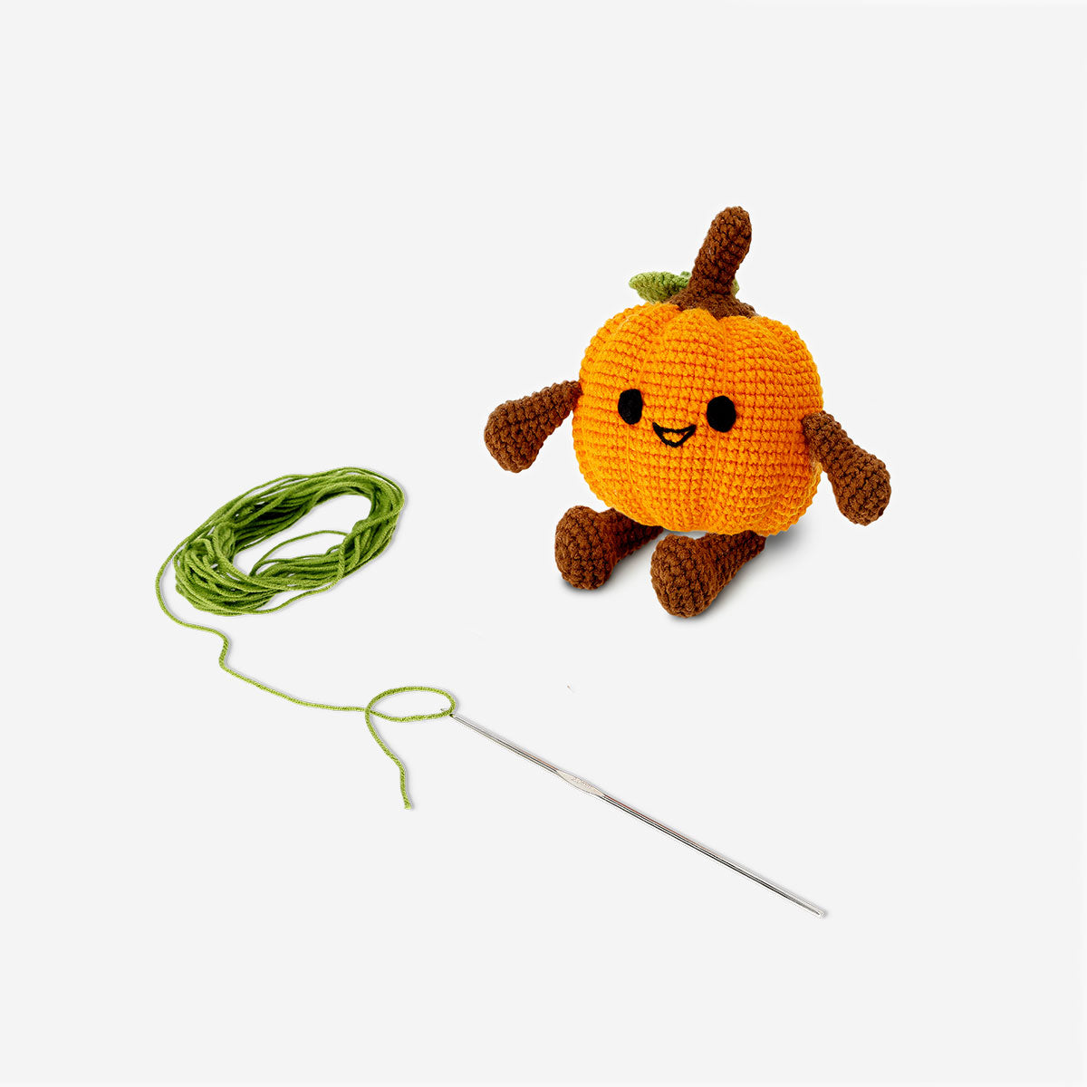 Crochet pumpkin kit from Flying Tiger Copenhagen, including colorful yarn and crochet hooks for craft projects.