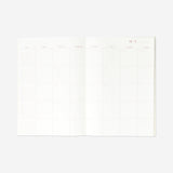A4 monthly planner with soft floral cover from Flying Tiger Copenhagen, featuring pages for organizing monthly schedules.
