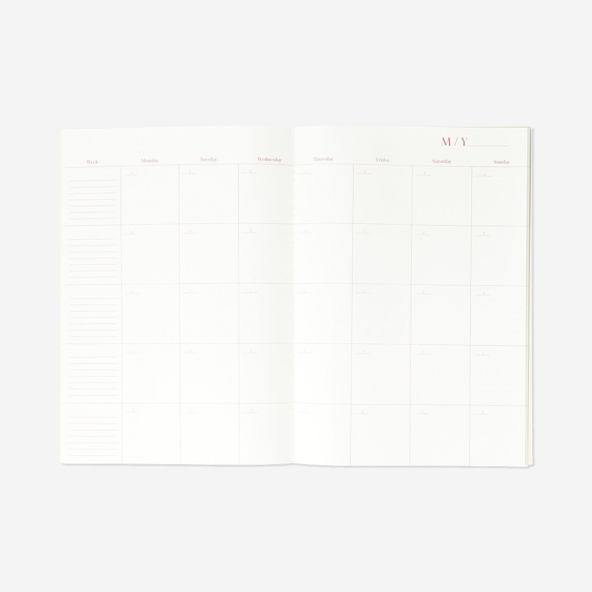 A4 monthly planner with soft floral cover from Flying Tiger Copenhagen, featuring pages for organizing monthly schedules.
