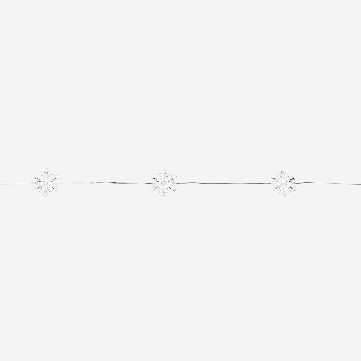 String lights with snowflake-shaped bulbs from Flying Tiger Copenhagen, perfect for cozy home decoration.