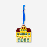 Yellow ceramic house hanging ornament, decorative home decor piece by Flying Tiger Copenhagen.