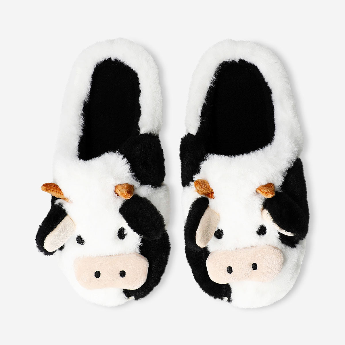 Textile cow slippers in size 37/38 from Flying Tiger Copenhagen with soft, cow print design and cozy interior.