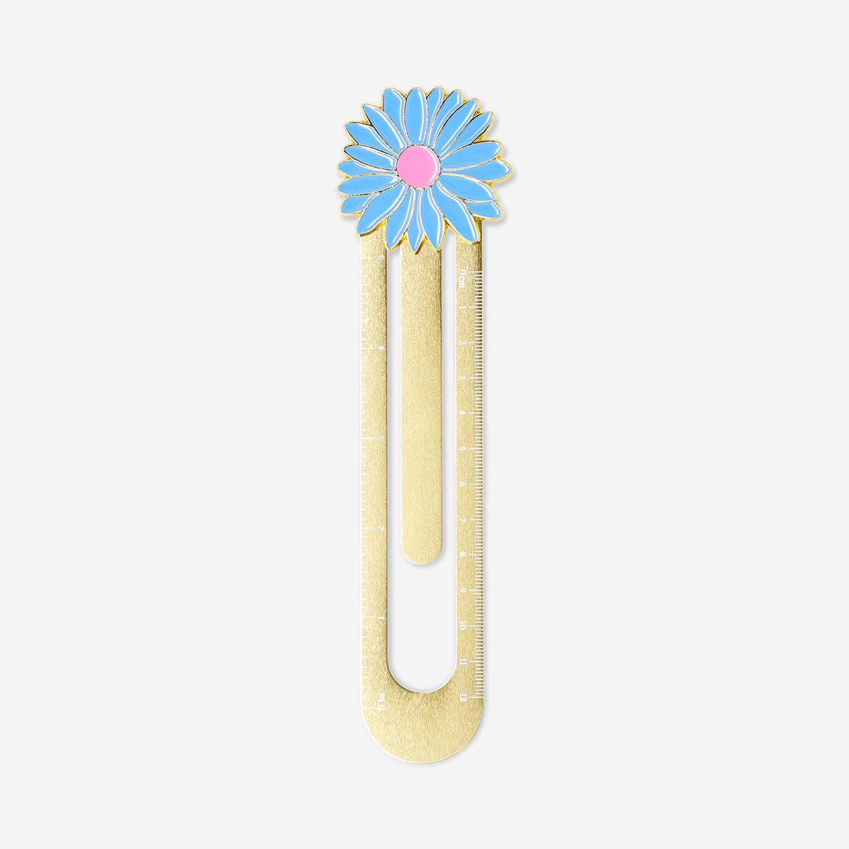 Gold metal office ruler with a decorative flower design from Flying Tiger Copenhagen on a white background.