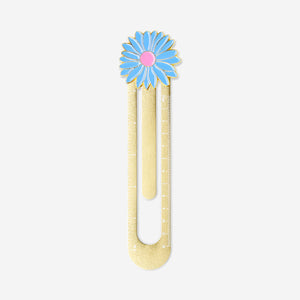 Gold metal office ruler with a decorative flower design from Flying Tiger Copenhagen on a white background.