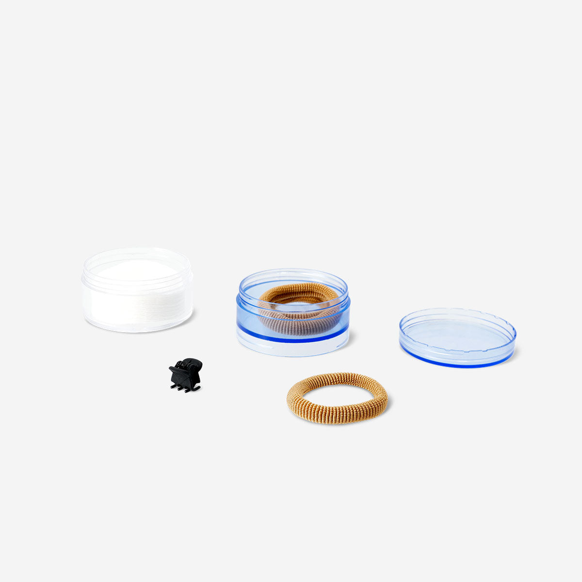 Three stackable personal care jars from Flying Tiger Copenhagen, featuring clear plastic containers with white lids for organization.