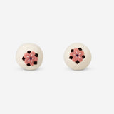 Two Flying Tiger Copenhagen wool laundry balls with colorful flower motifs for eco-friendly washing.