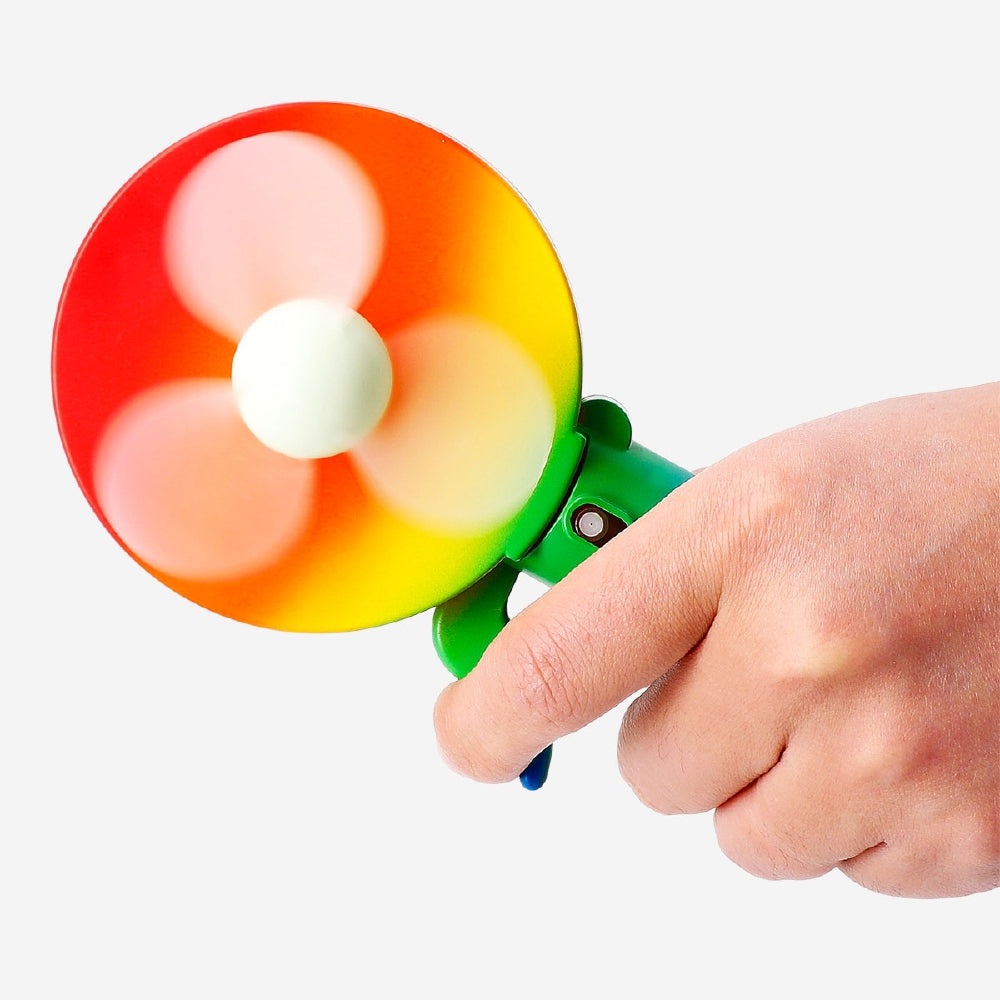 Rainbow-colored handheld fan gadget by Flying Tiger Copenhagen with vibrant rainbow stripes and compact design.