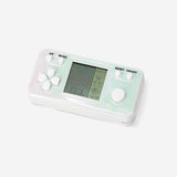 Flying Tiger Copenhagen gadget game console with multiple colorful game cartridges and sleek design.