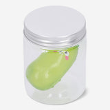 Flying Tiger Copenhagen Press Me Toy Pickle gadget with a colorful, squeezable pickle design and playful appearance.