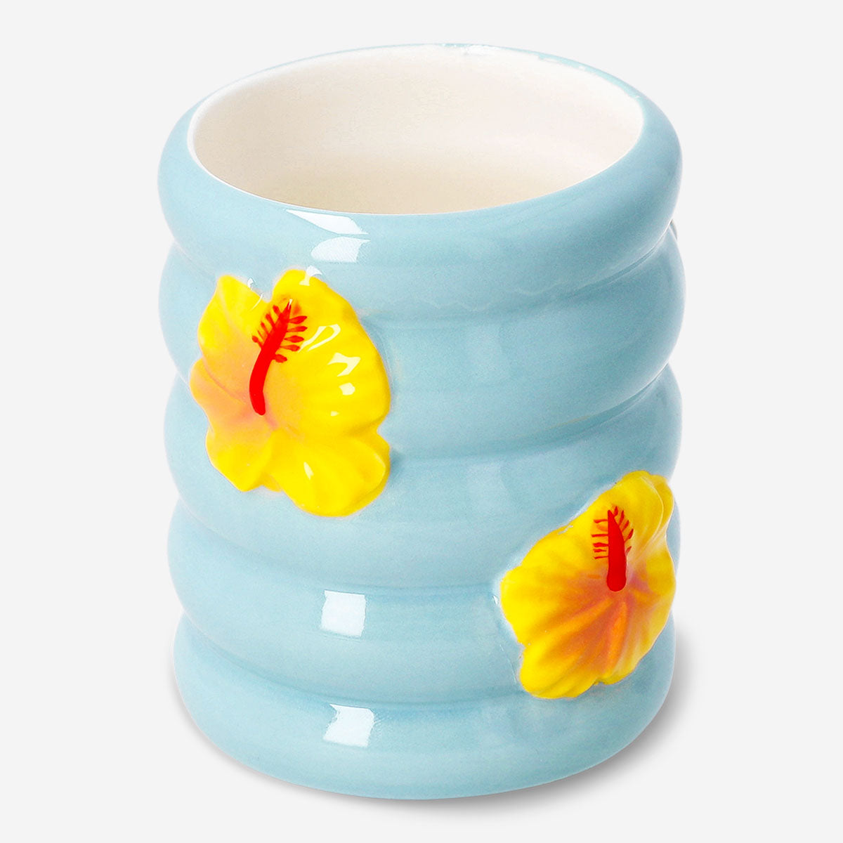 Ceramic tooth mug with hibiscus flower print, Flying Tiger Copenhagen home decor, featuring a detailed floral design.