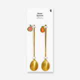Two gold dessert spoons with fruit-shaped decoration from Flying Tiger Copenhagen, perfect for elegant kitchen serving.