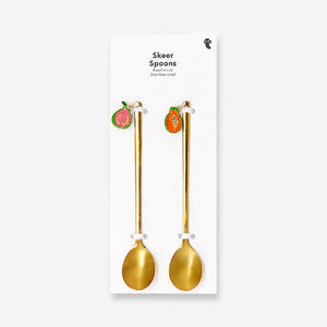 Two gold dessert spoons with fruit-shaped handles, featuring decorative fruit details, perfect for elegant kitchen serving.
