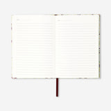 A5 floral notebook from Flying Tiger Copenhagen with colorful floral cover and lined pages for office use.