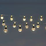String lights with clear bulbs by Flying Tiger Copenhagen, perfect for home decor, featuring a string of illuminated glass bulbs.
