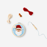 Punch needle Santa set by Flying Tiger Copenhagen, featuring colorful tools and materials for holiday embroidery crafts.