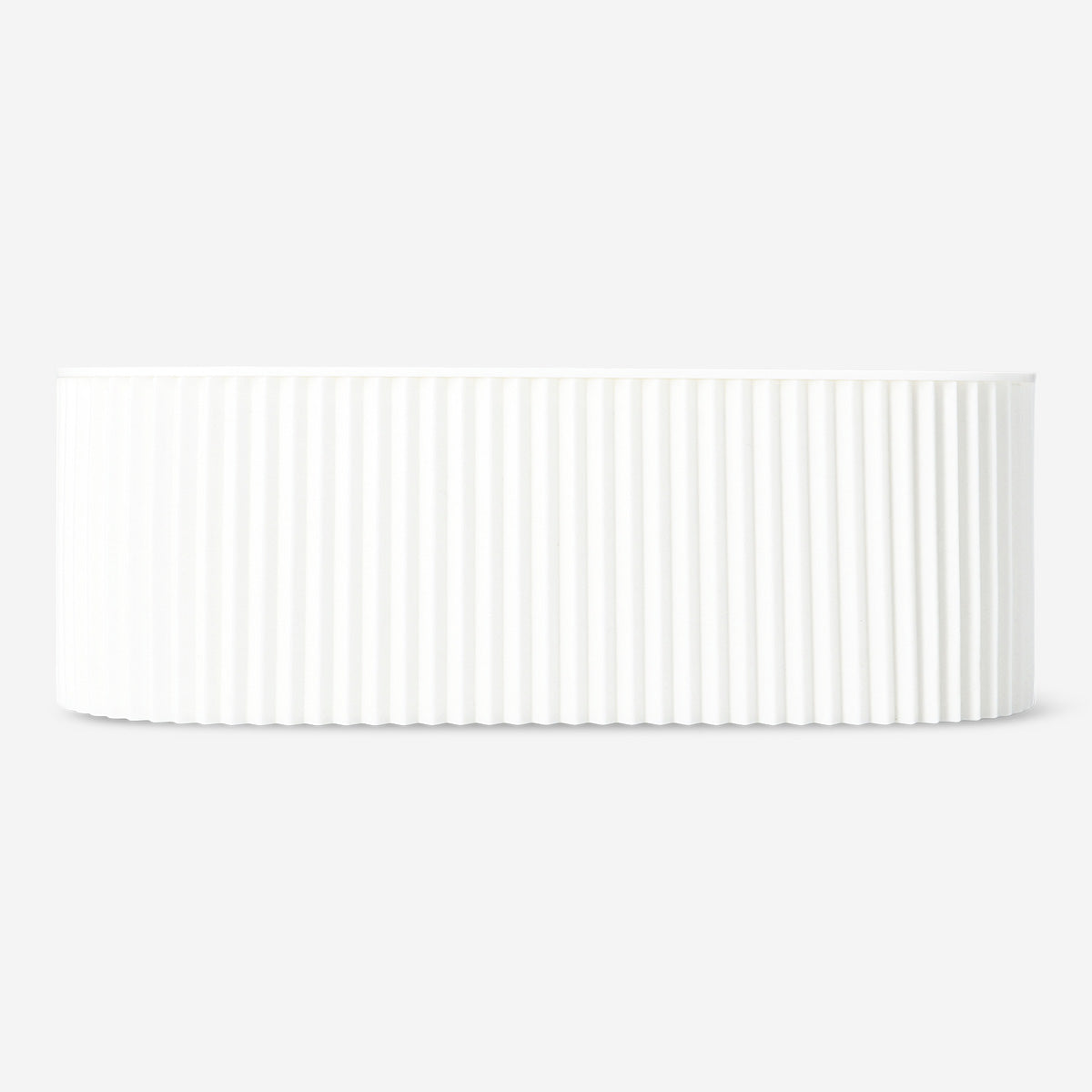 White cable tidy unit for home organization by Flying Tiger Copenhagen, neatly wrapped cords to reduce clutter.