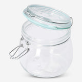 Glass jar with green rim, 13 cm tall, for kitchen storage, by Flying Tiger Copenhagen, shown with a clear view of its design.