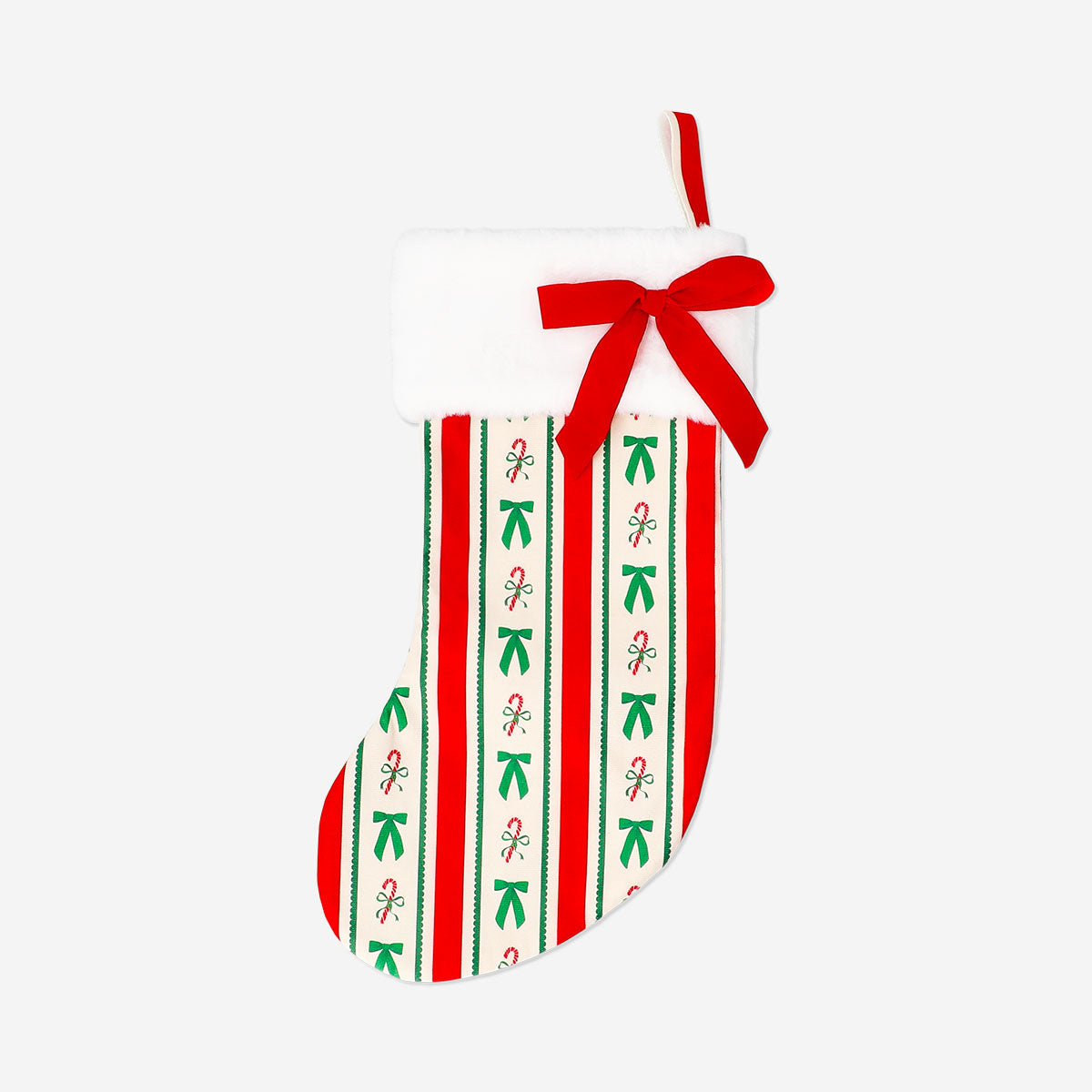 Velvet Christmas stocking in red with white cuff, hanging on a mantel, by Flying Tiger Copenhagen for festive holiday decor.