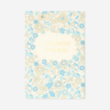 Floral wellness journal from Flying Tiger Copenhagen with colorful floral cover, designed for office use and personal wellness.