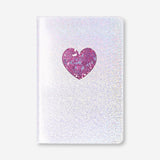 Silver A5 office notebook with a heart design by Flying Tiger Copenhagen, featuring a smooth cover and compact size for note-taking.