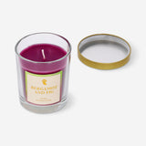 Scented candle with bergamot and fig fragrance in a glass holder, ideal for home decor and creating a cozy atmosphere.