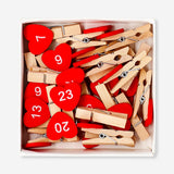 Set of 24 office pegs with heart and number designs by Flying Tiger Copenhagen, displayed on a white background.