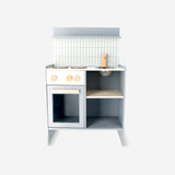 Wooden toy play kitchen by Flying Tiger Copenhagen, featuring realistic stove, sink, and storage compartments for imaginative play.