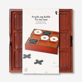 Wooden Tic Tac Toe game in natural wood finish by Flying Tiger Copenhagen, featuring a classic grid and game pieces.