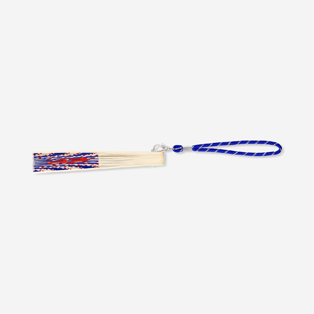 Foldable bamboo fan with strap featuring Ciao Ciao print, made of textile by Flying Tiger Copenhagen, shown open with decorative details.